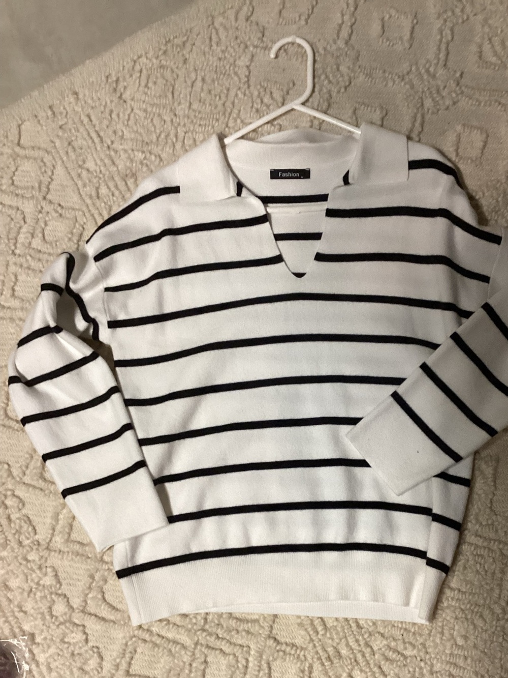 White and black stripe sweater, size m
